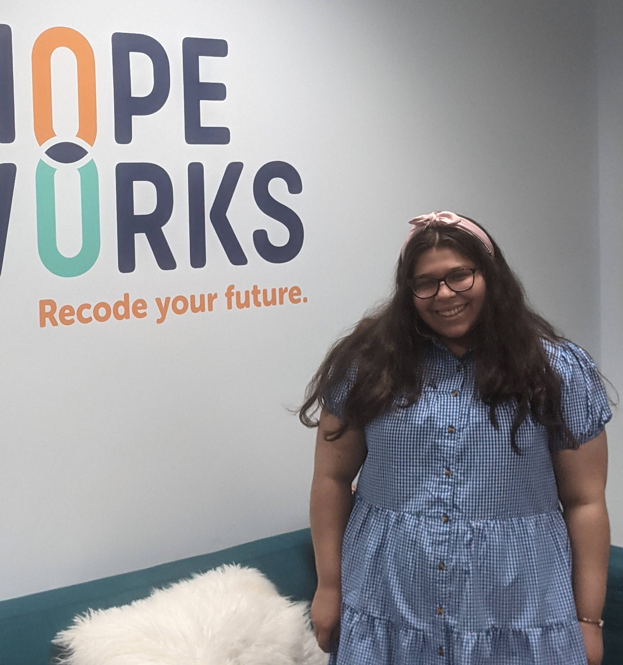 Luisa stands in Hopeworks office